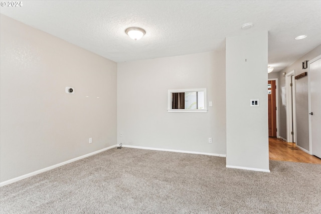 3320 NE 29th St, Gresham, OR 97030 - unfurnished room featuring light colored carpet, a textured ceiling, and a smoke detector