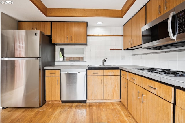 3320 NE 29th St, Gresham, OR 97030 - kitchen featuring appliances with stainless steel finishes, tasteful backsplash, light wood finished floors, a raised ceiling, and open shelves