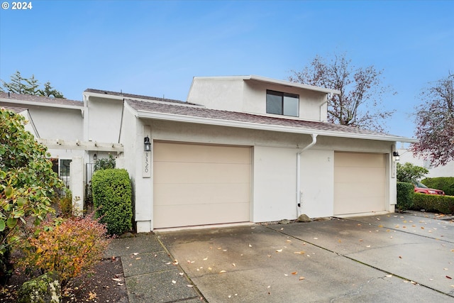 3320 NE 29th St, Gresham, OR 97030 - view of front of property with stucco siding, concrete driveway, and roof with shingles