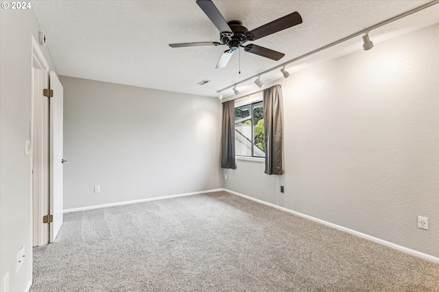 3320 NE 29th St, Gresham, OR 97030 - empty room with track lighting, a ceiling fan, carpet flooring, and a textured ceiling
