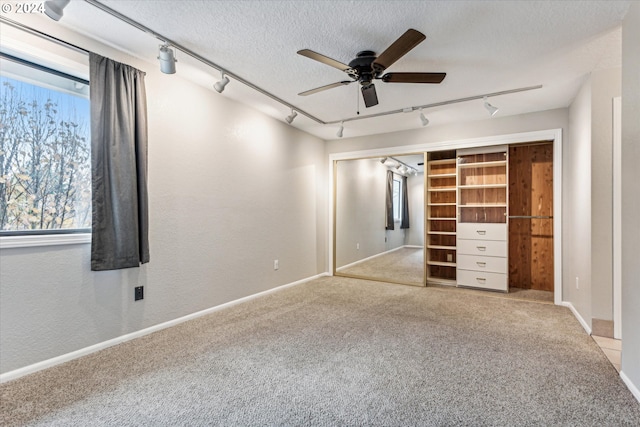 3320 NE 29th St, Gresham, OR 97030 - unfurnished bedroom with track lighting, carpet flooring, baseboards, and a textured ceiling