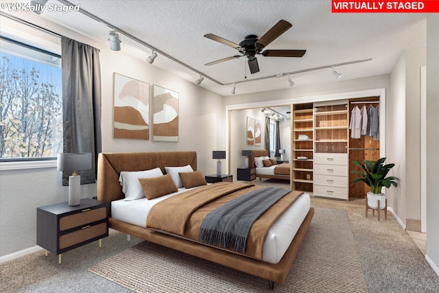3320 NE 29th St, Gresham, OR 97030 - carpeted bedroom featuring rail lighting and a textured ceiling