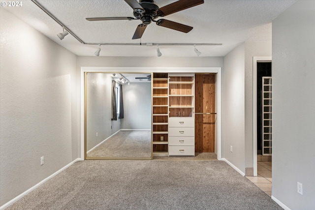 3320 NE 29th St, Gresham, OR 97030 - unfurnished bedroom with rail lighting, carpet floors, a textured ceiling, and a ceiling fan