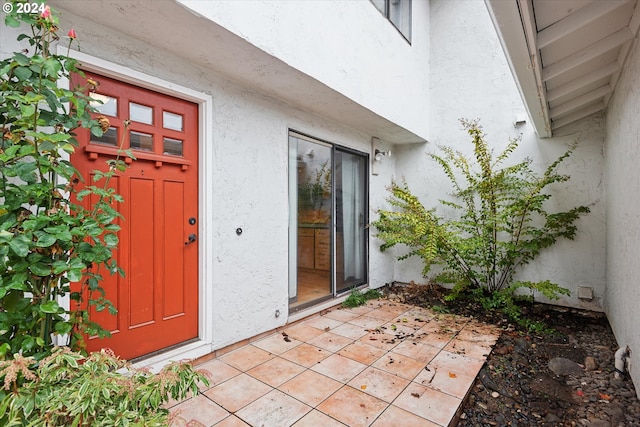 property entrance with a patio area