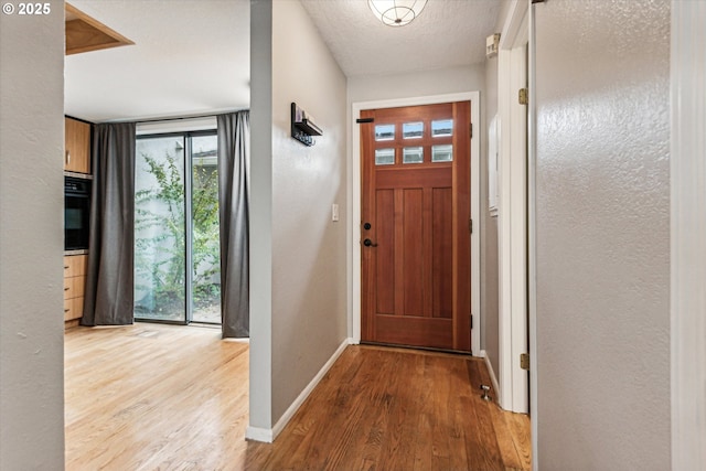 3320 NE 29th St, Gresham, OR 97030 - entrance foyer featuring wood finished floors and plenty of natural light