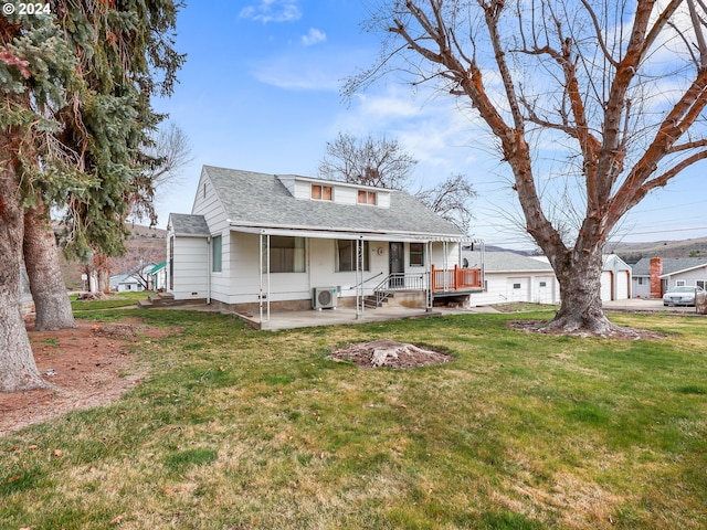 rear view of house featuring central AC, a patio area, and a yard