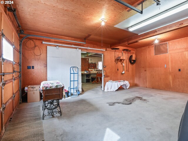 garage featuring wood walls