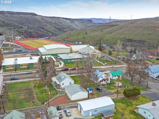 birds eye view of property with a mountain view