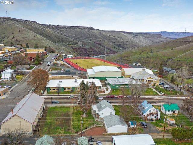 birds eye view of property with a mountain view