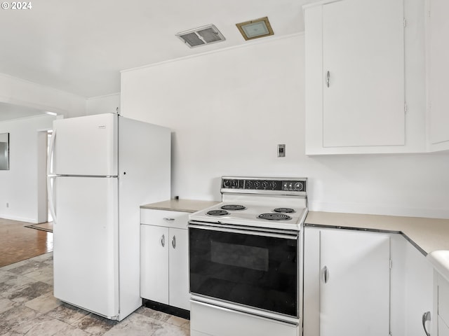 kitchen featuring white appliances, light tile floors, and white cabinets