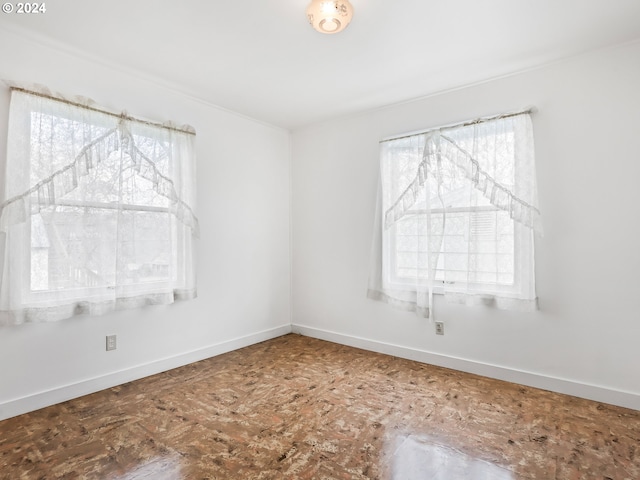 spare room with plenty of natural light