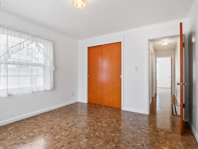 unfurnished bedroom with a closet