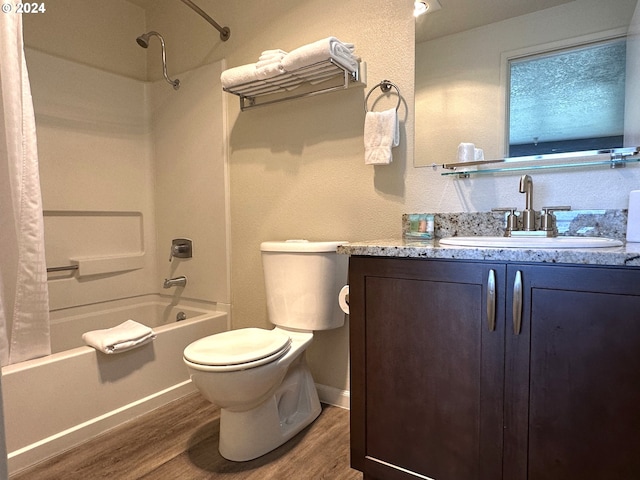 full bathroom featuring toilet, shower / bath combo with shower curtain, vanity, and hardwood / wood-style flooring