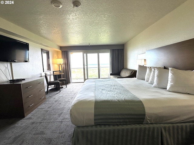 carpeted bedroom with a textured ceiling