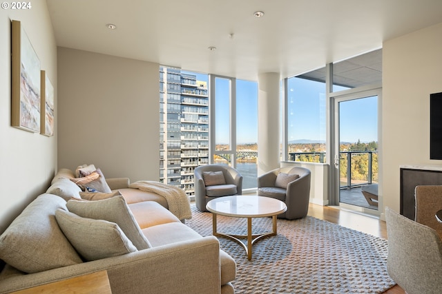 living room with floor to ceiling windows and hardwood / wood-style floors