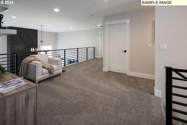 1108 N Helens View Dr, Ridgefield, WA 98642 - living area with carpet floors, baseboards, a chandelier, recessed lighting, and an upstairs landing