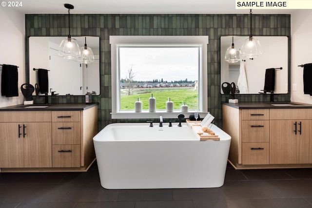 1108 N Helens View Dr, Ridgefield, WA 98642 - full bathroom featuring tile patterned flooring, two vanities, a freestanding tub, and tasteful backsplash
