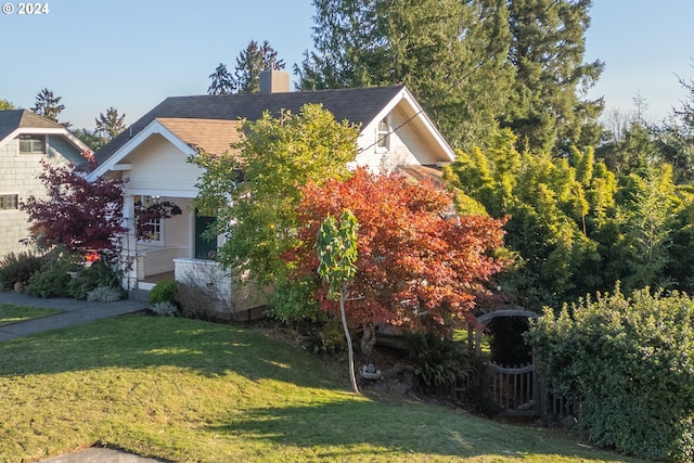 509 Kensington Ave, Astoria, OR 97103 - view of front of house with a chimney, covered porch, and a front yard