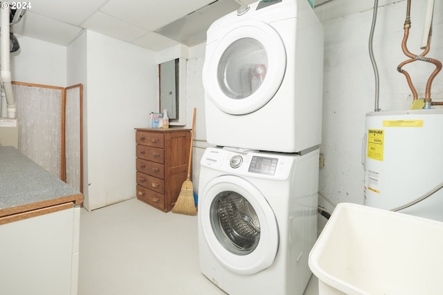 509 Kensington Ave, Astoria, OR 97103 - washroom featuring laundry area, a sink, electric water heater, and stacked washer / drying machine