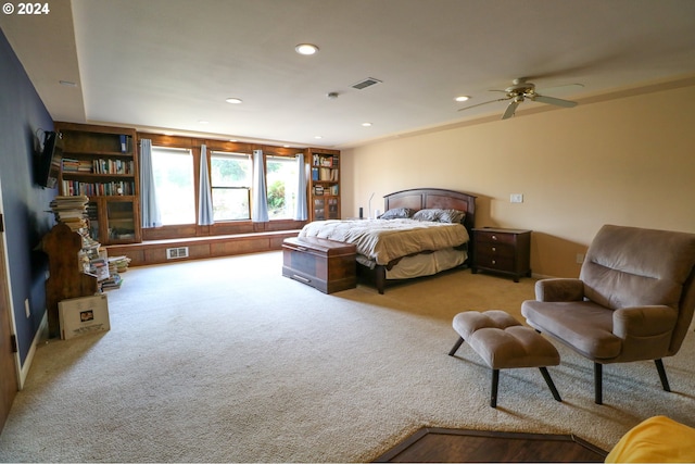 bedroom featuring ceiling fan and carpet