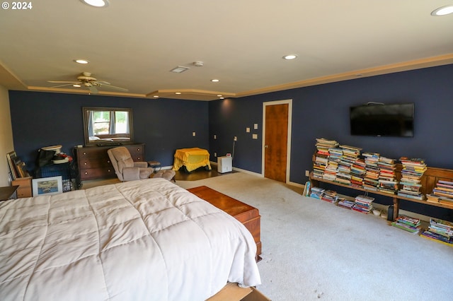 bedroom with ceiling fan, ornamental molding, and carpet floors