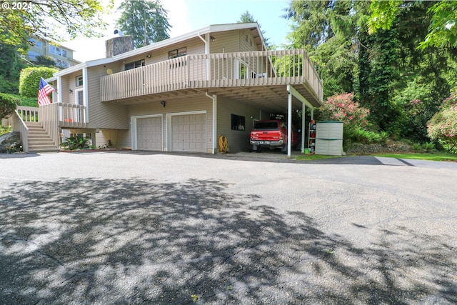 exterior space featuring a carport and a garage