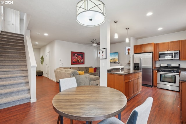 dining area featuring dark hardwood / wood-style flooring and ceiling fan