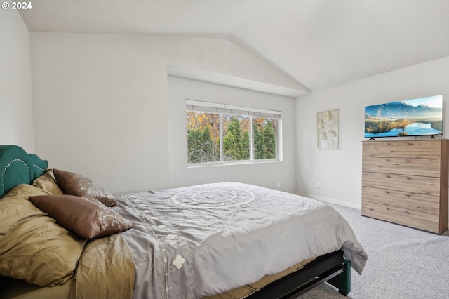 bedroom featuring carpet flooring and vaulted ceiling