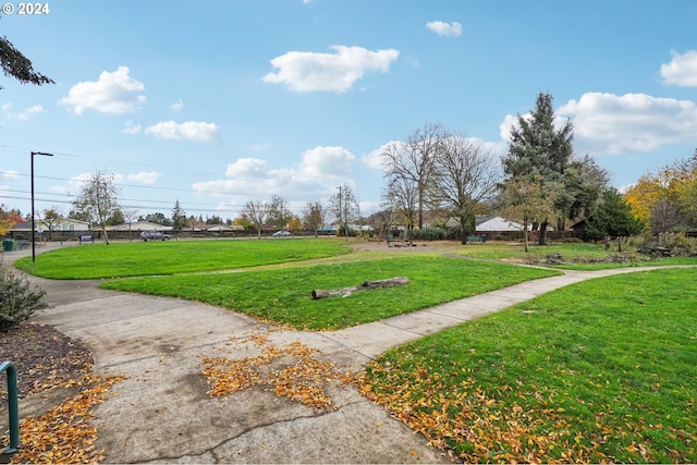 view of property's community with a lawn