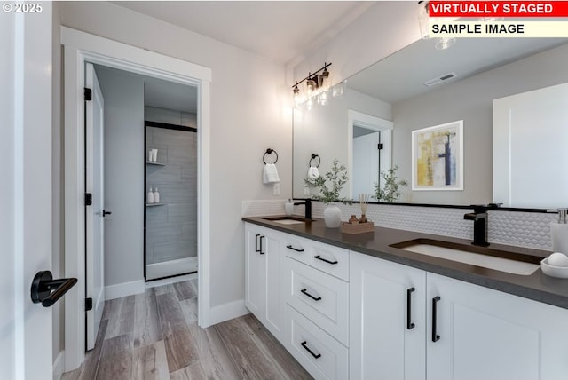 bathroom featuring wood-type flooring and vanity