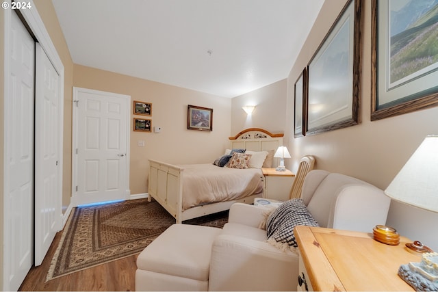 bedroom with hardwood / wood-style flooring and a closet