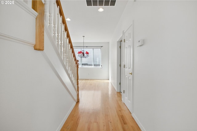 5306 NW Skycrest Pkwy, Portland, OR 97229 - corridor with stairway, baseboards, visible vents, and light wood-style flooring