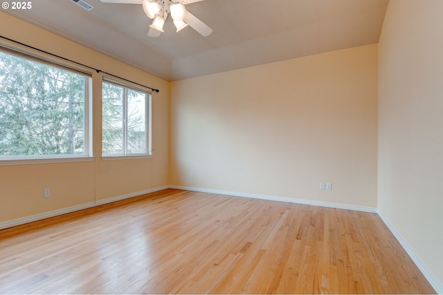 spare room featuring ceiling fan and light wood-type flooring