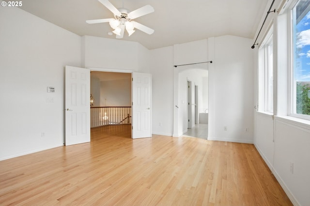 5306 NW Skycrest Pkwy, Portland, OR 97229 - unfurnished bedroom with arched walkways, lofted ceiling, and light wood finished floors