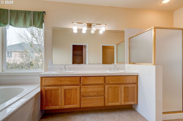 bathroom with independent shower and bath, vanity, and tile patterned flooring