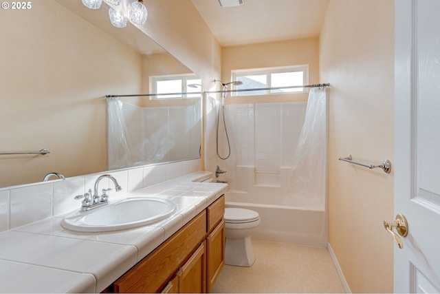 full bathroom with vanity, toilet, and shower / bath combo with shower curtain