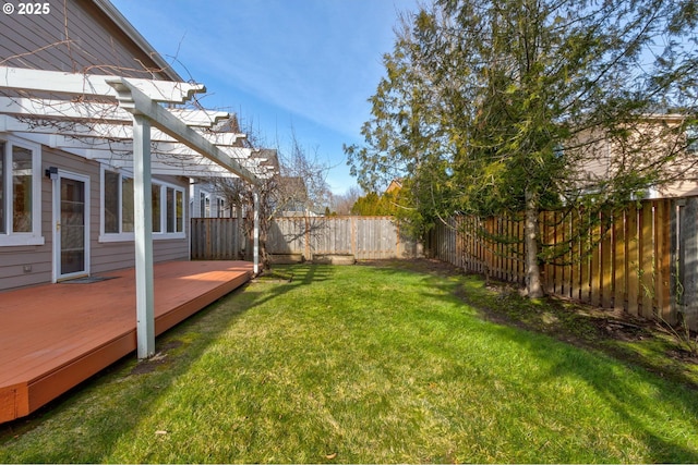 view of yard with a wooden deck and a pergola