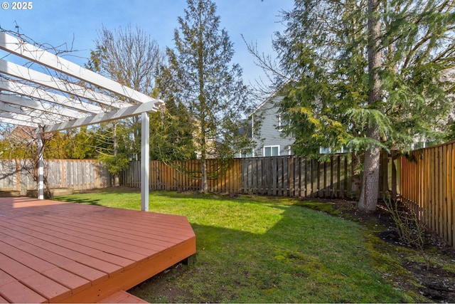 view of yard featuring a wooden deck and a pergola