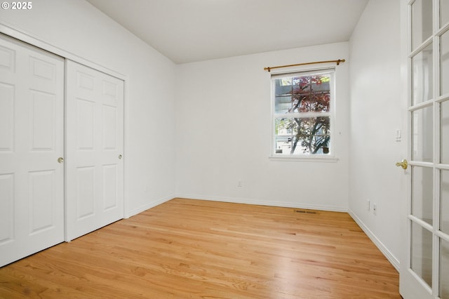 5306 NW Skycrest Pkwy, Portland, OR 97229 - unfurnished bedroom featuring baseboards, light wood-style floors, and a closet