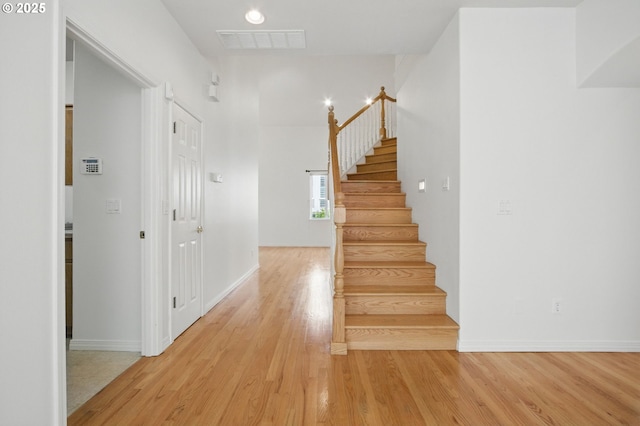 5306 NW Skycrest Pkwy, Portland, OR 97229 - stairs with baseboards, wood finished floors, and visible vents