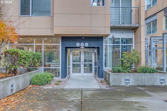 view of exterior entry featuring french doors