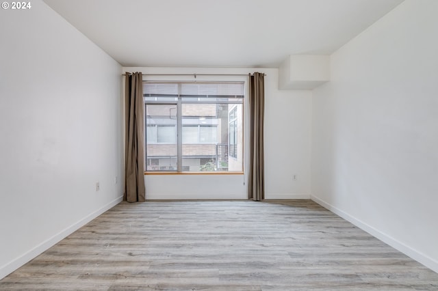 unfurnished room featuring light hardwood / wood-style flooring