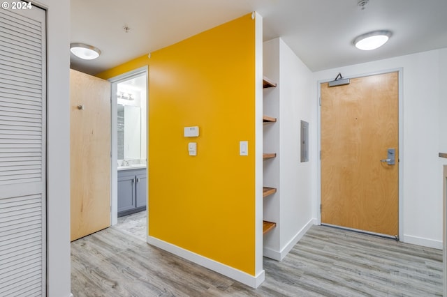 hall with light hardwood / wood-style flooring