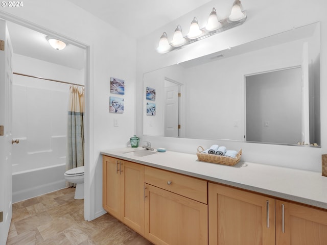 full bathroom featuring vanity, toilet, and shower / tub combo with curtain