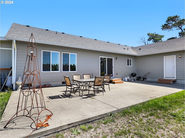 rear view of house featuring a patio