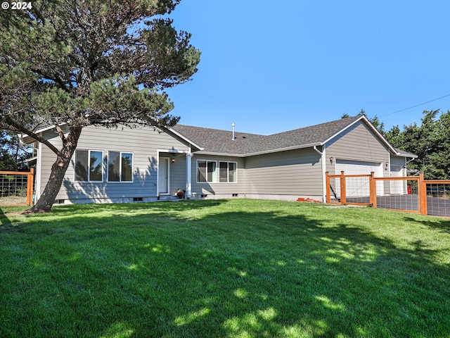 single story home with a garage, fence, a shingled roof, and a front lawn