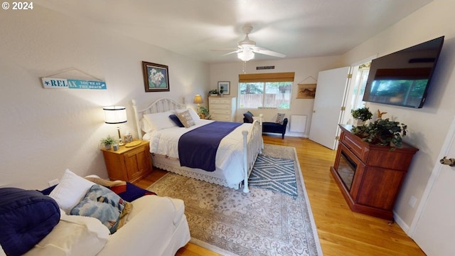 bedroom with light wood finished floors and ceiling fan