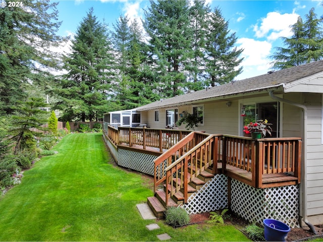 exterior space featuring a lawn and fence