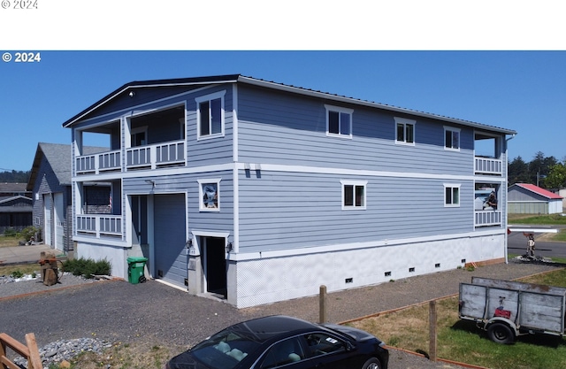35165 Rueppell Ave, Pacific City, OR 97135 - view of front facade featuring a balcony and crawl space