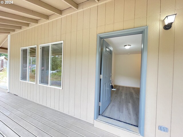 entrance to property featuring a wooden deck